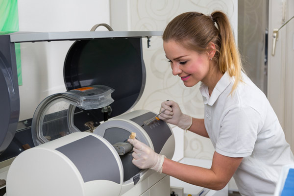 Dental assistant assisting with CEREC technology at Capital Dental Center in Washington, DC.